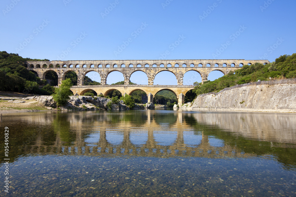 Fototapeta premium Three-tiered aqueduct Pont du Gard was built in Roman times on the river Gardon - France