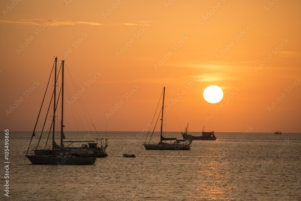 Ship yachts on the sea in sunset time