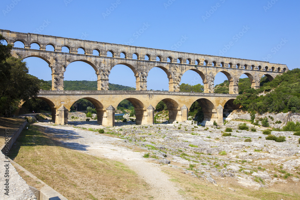 Three-tiered aqueduct Pont du Gard was built in Roman times on the river Gardon - France