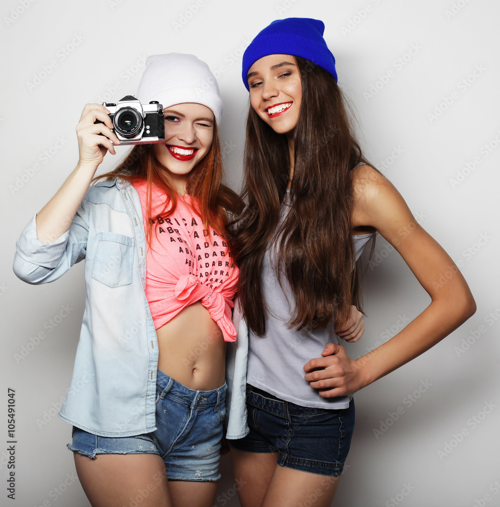 lifestyle portrait of two pretty teen girlfriends smiling and ha lifestyle portrait of two pretty teen girlfriends smiling and ha