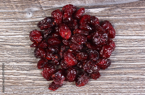 Heap of red cranberries on wooden table