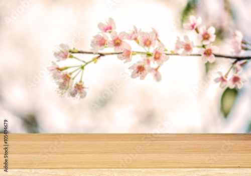 Wood table top on blur  Flower background © escapejaja