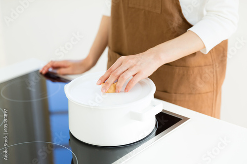 young asian woman cooking image photo