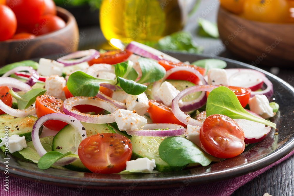 fresh vegetable salad with feta cheese on a plate fresh vegetable salad with feta cheese on a plate