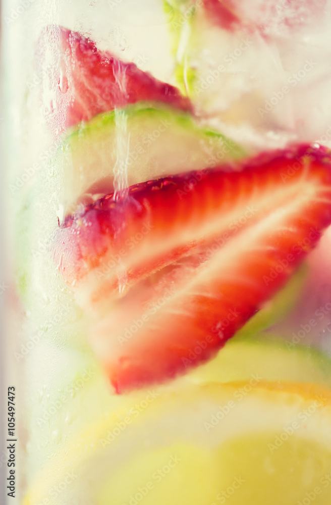 close up of fruit water in glass bottle close up of fruit water in glass bottle