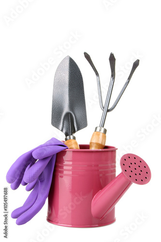 iron watering can with garden tools and rubber gloves isolated on white background