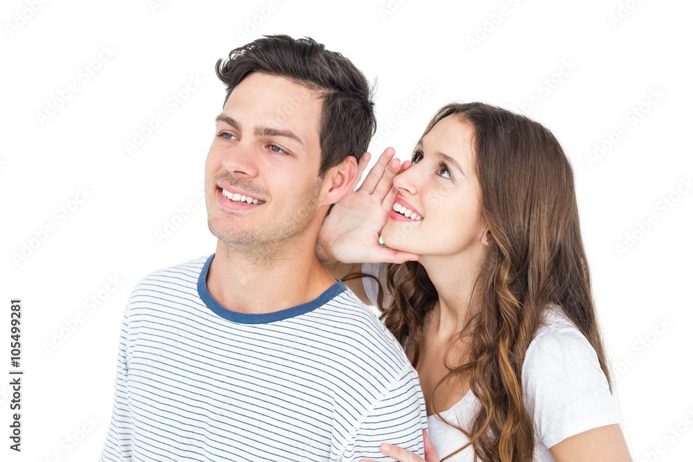 Young couple sharing a secret Young couple sharing a secret
