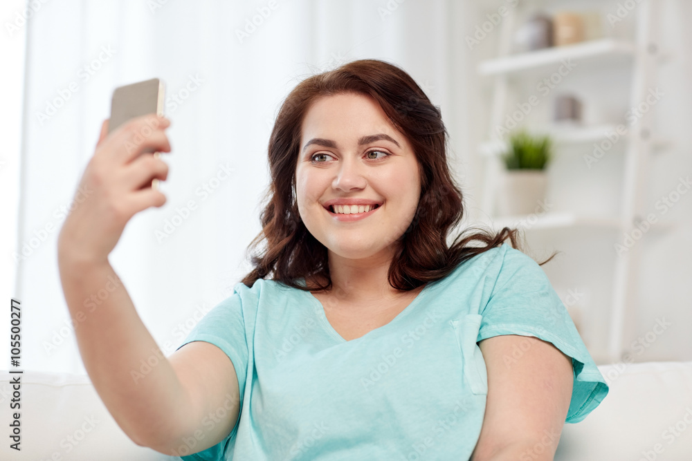 happy plus size woman with smartphone at home happy plus size woman with smartphone at home