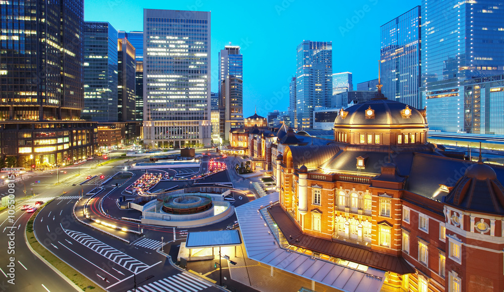 Tokyo railway station and Tokyo highrise building at twilight time Tokyo railway station and Tokyo highrise building at twilight time