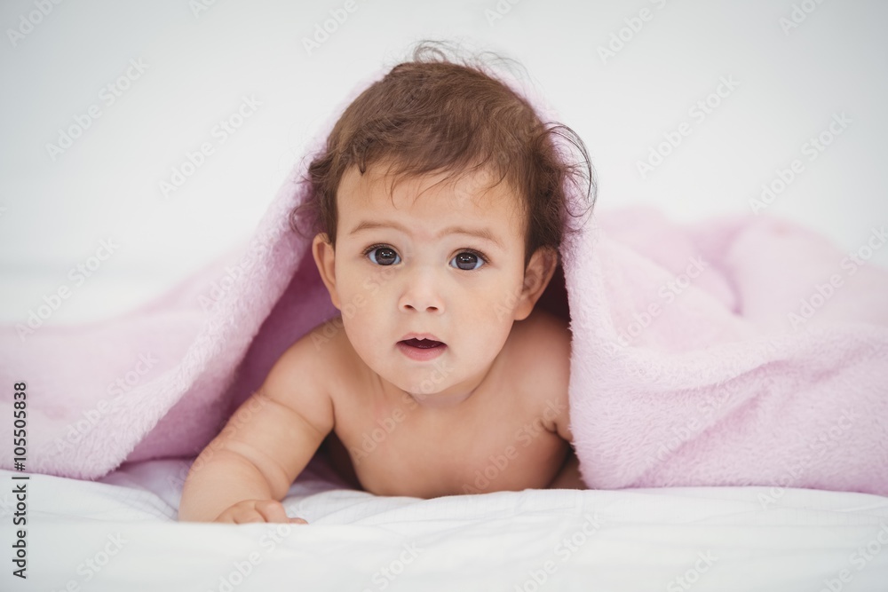 Portrait of cute baby lying under blanket Portrait of cute baby lying under blanket