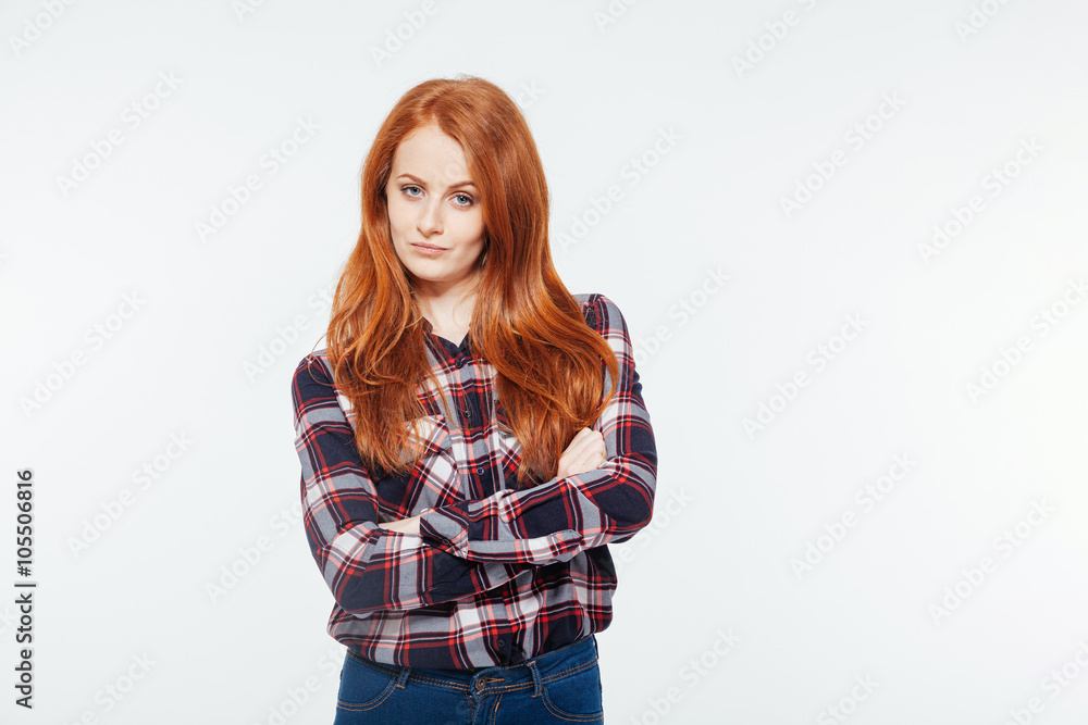 Serious woman standing with arms folded Serious woman standing with arms folded