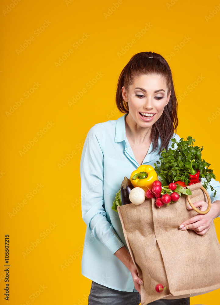 healthy lifestyle with green vegan food. young woman hold shoppi