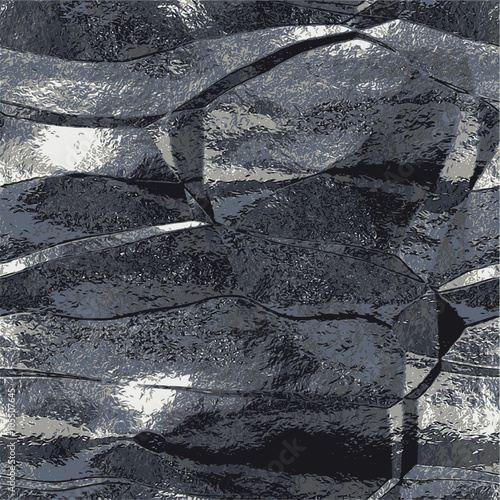 Abstract black, gray and white scratched background resembling brushed metal foil