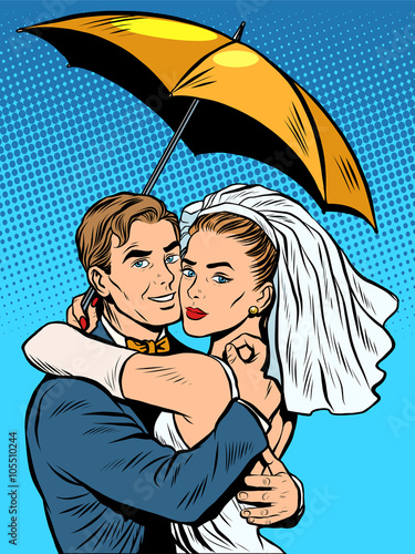 Couple in love bride and groom under an umbrella