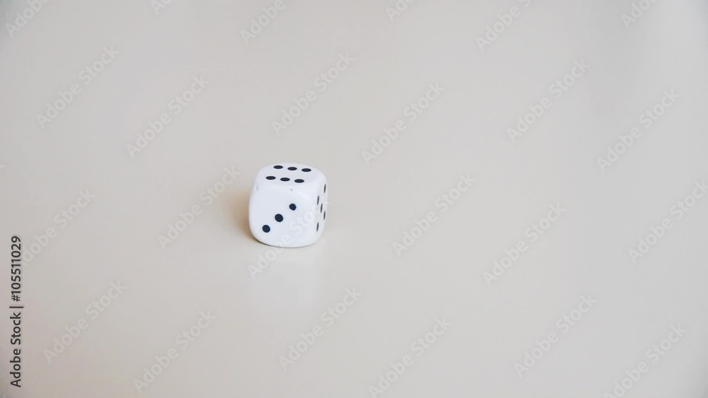 Dice rolling on the table. Slow motion. Close-up. Dice rolling on the table. Slow motion. Close-up.