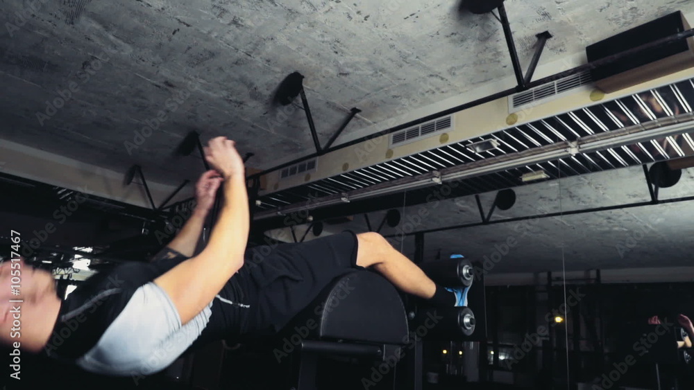 man doing sit-ups at the gym slow motion man doing sit-ups at the gym slow motion
