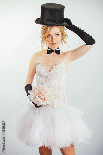 blonde bride in tophat with veil and long black gloves