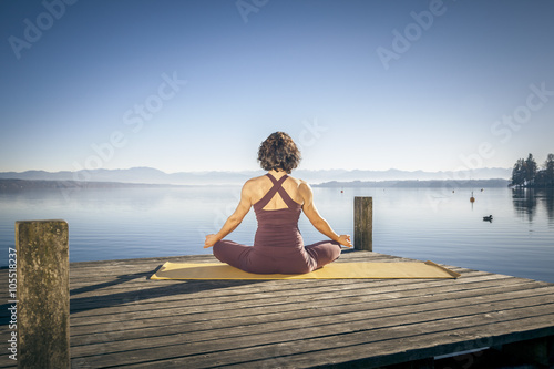 yoga woman sitting lake