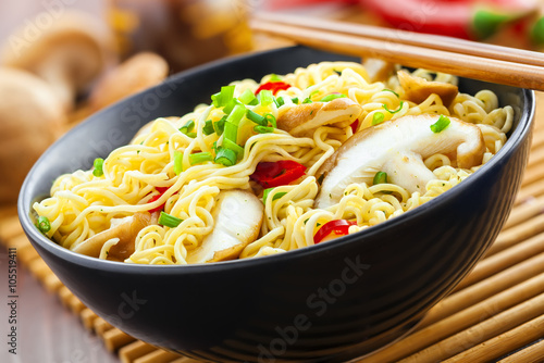 Asian meal made of instant noodles and shiitake mushrooms, traditional oriental food, close-up
