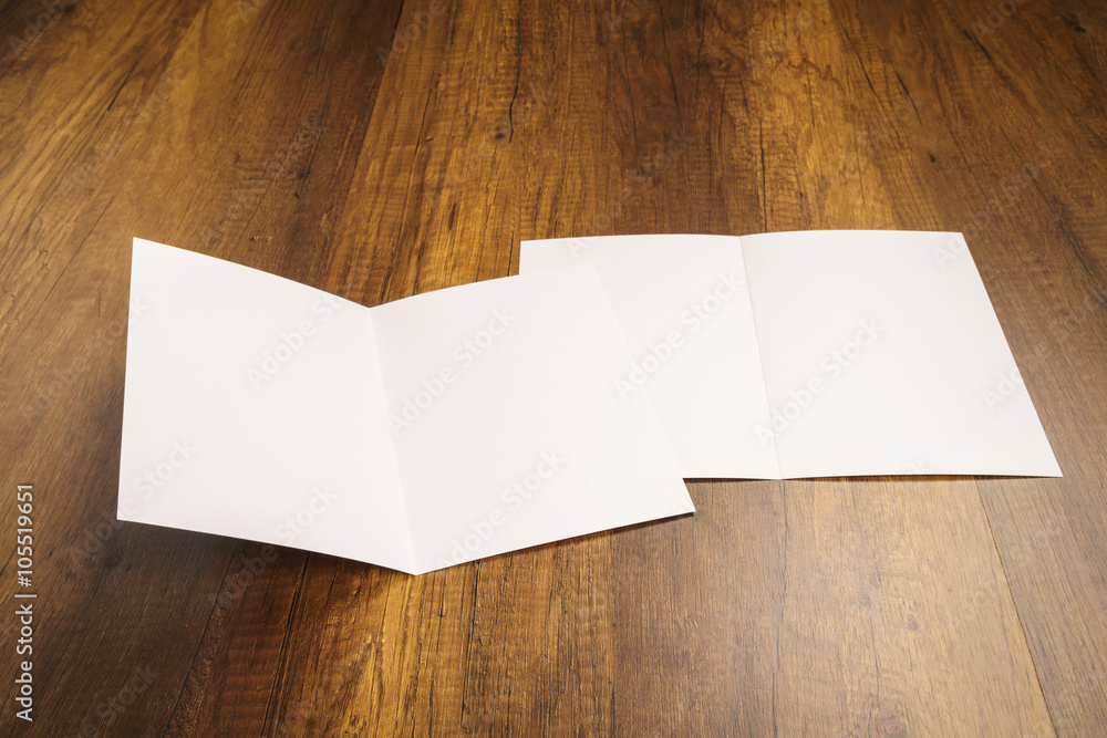 Bifold white template paper on wood texture Bifold white template paper on wood texture