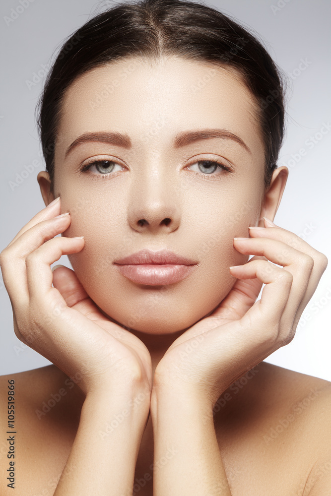 Beautiful young woman with perfect clean shiny skin, natural fashion makeup. Close-up woman, fresh spa look Beautiful young woman with perfect clean shiny skin, natural fashion makeup. Close-up woman, fresh spa look