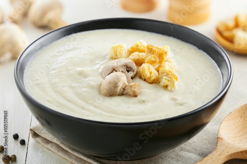 Tasty mushroom cream soup for lunch, ingredients on a table, European food