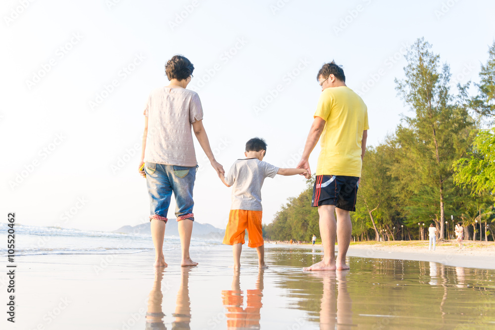 Family having fun on a sandy beach Family having fun on a sandy beach
