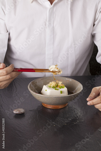 Japanese tofu, Japanese soft cold tofu with sauce in a dish on dining table