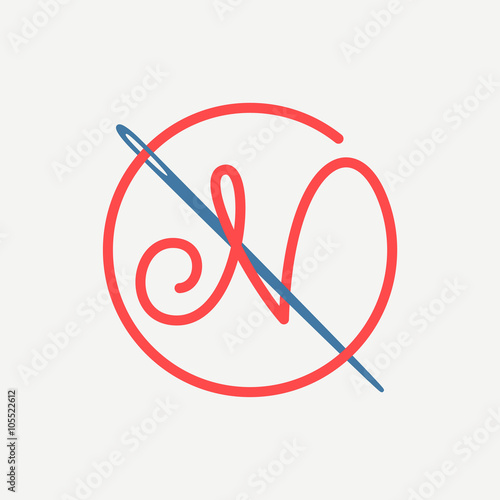 N letter logo with needle and thread.