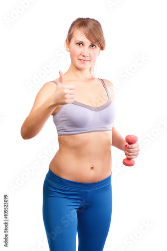 The girl goes in for sports with dumbbells on a white background.