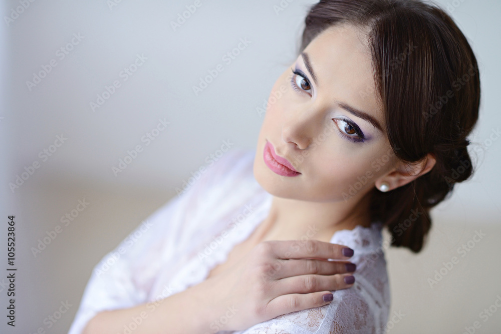 Female portrait of cute lady in white bra indoors. Close-up beautiful sexy model girl in elegant pose. Beauty brunette woman with hairstyle Female portrait of cute lady in white bra indoors. Close-up beautiful sexy model girl in elegant pose. Beauty brunette woman with hairstyle