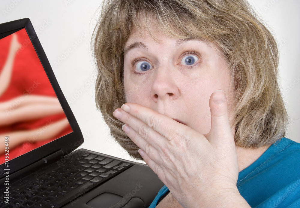 Girl Looking At Computer Porn - Internet Porn â€“ A shocked woman sees porn on her laptop computer. Stock  Photo | Adobe Stock