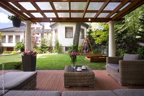 Fototapeta Gazebo with stylish garden furniture