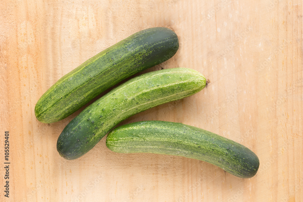 top view of Cucumber on wood background top view of Cucumber on wood background