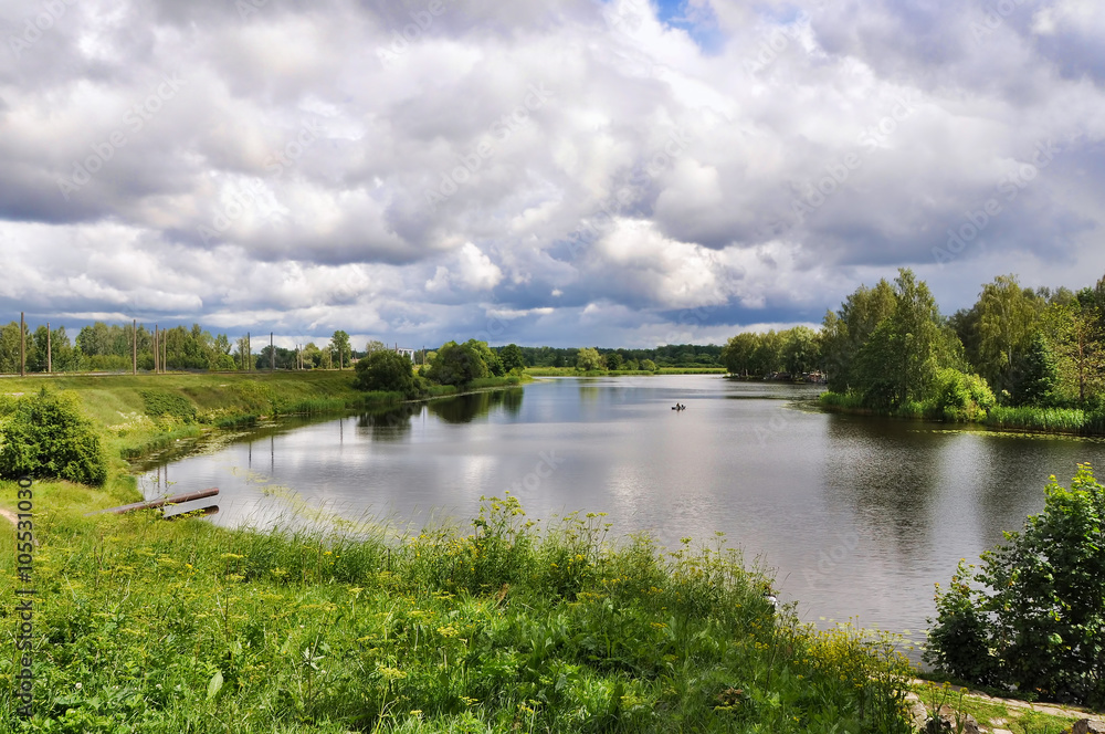 Landscape with lake reflection clouds Latvia, Jugla