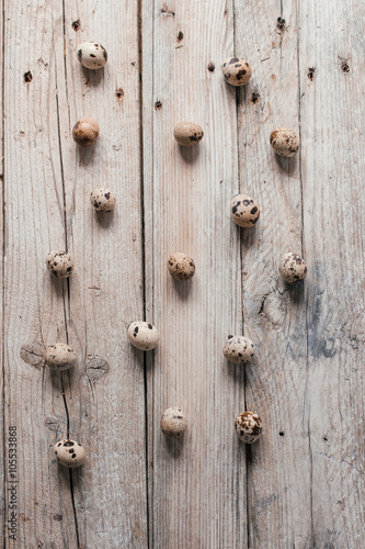 Quail eggs on wooden background