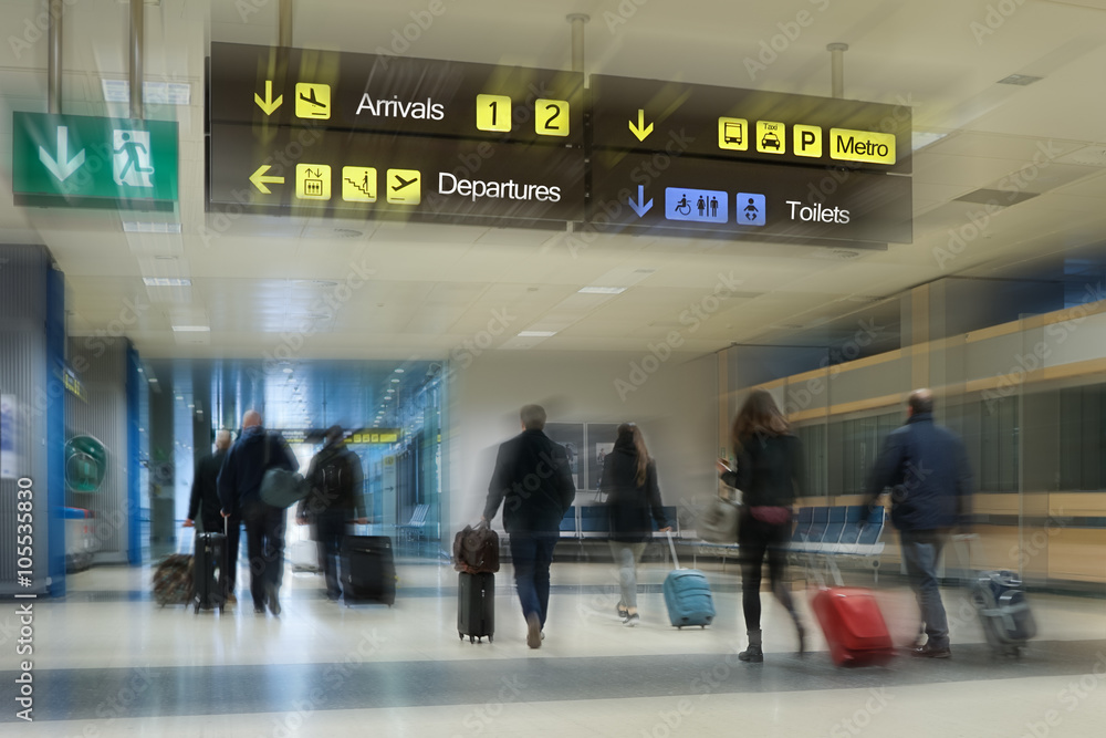 Airline passengers inside an Airport Airline passengers inside an Airport