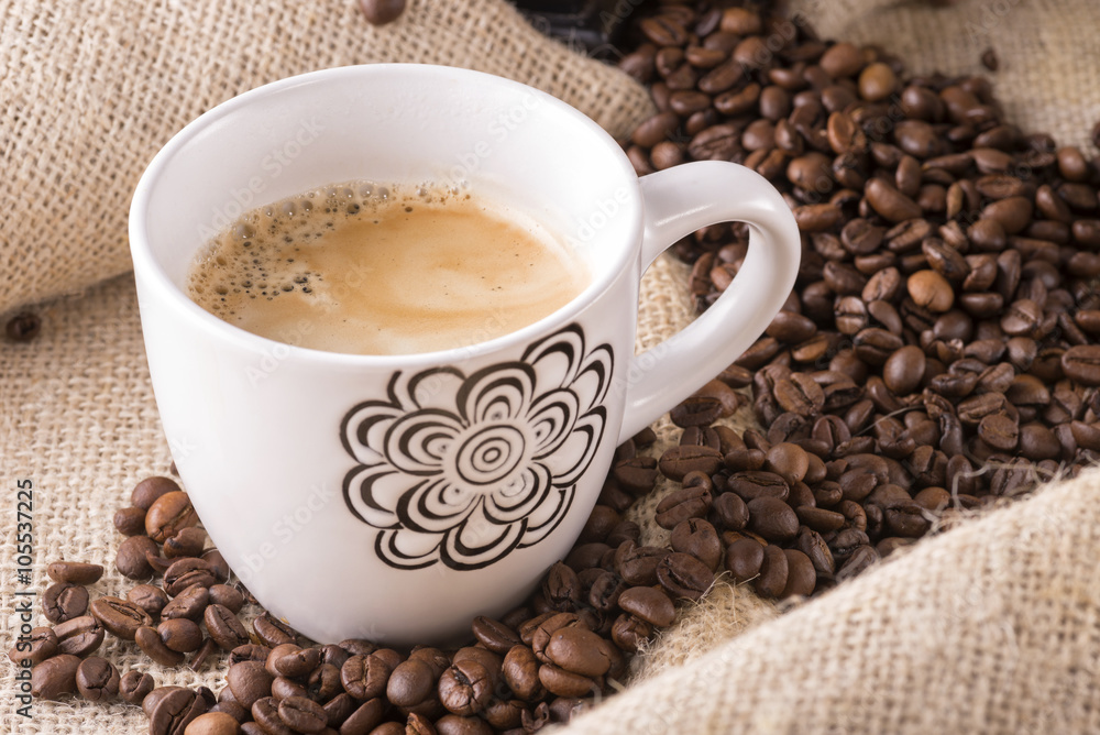 Coffee cup and beans. Coffee cup and beans.