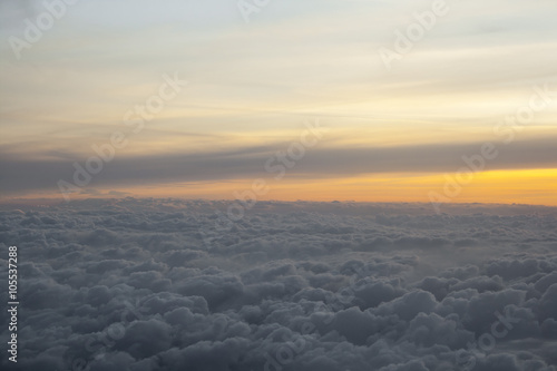 High above the clouds with beautiful sunset light