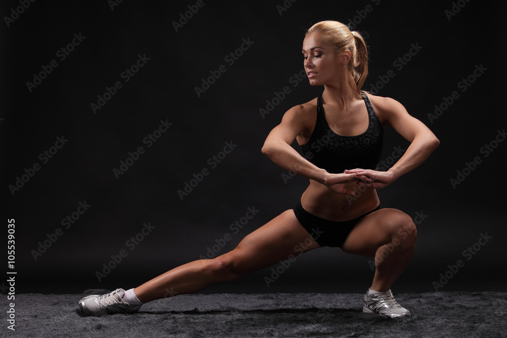 Young beautiful sporty woman Fit sportswoman stretching