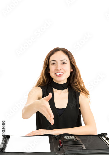 Friendly business woman reaching out her hand for hand shake