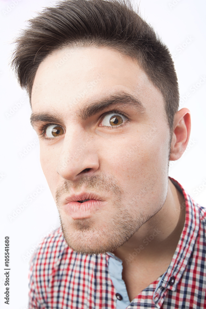 Obraz premium Funny crazy evil insane grotesque men’s face isolated on white background