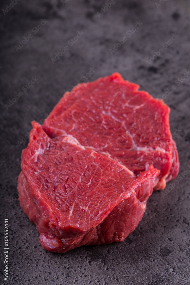 Steak. Raw beef steak. Fresh raw Sirloin beef steak sliced o Herb - Rosemary decoration.