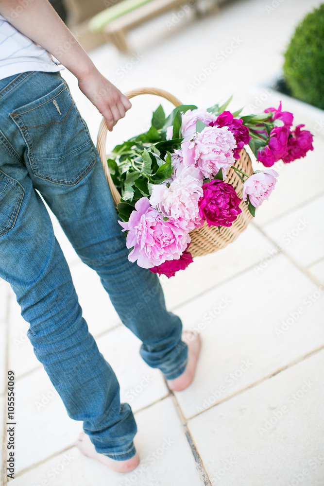 Small baby boy holding a peony flower Small baby boy holding a peony flower