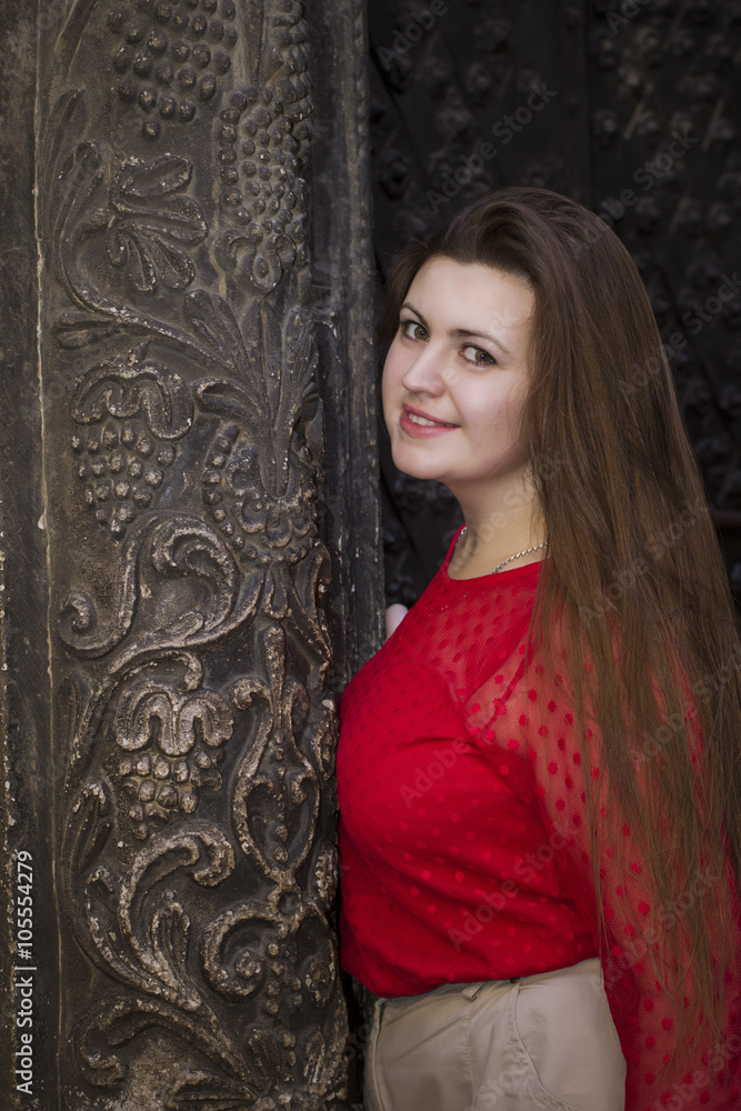 Beautiful  woman near the old building in Lviv