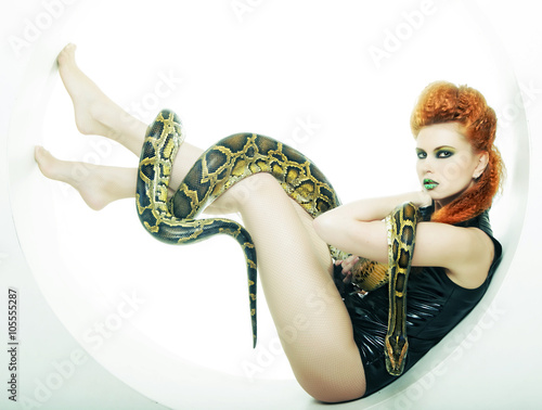 woman with creative make up holding Python