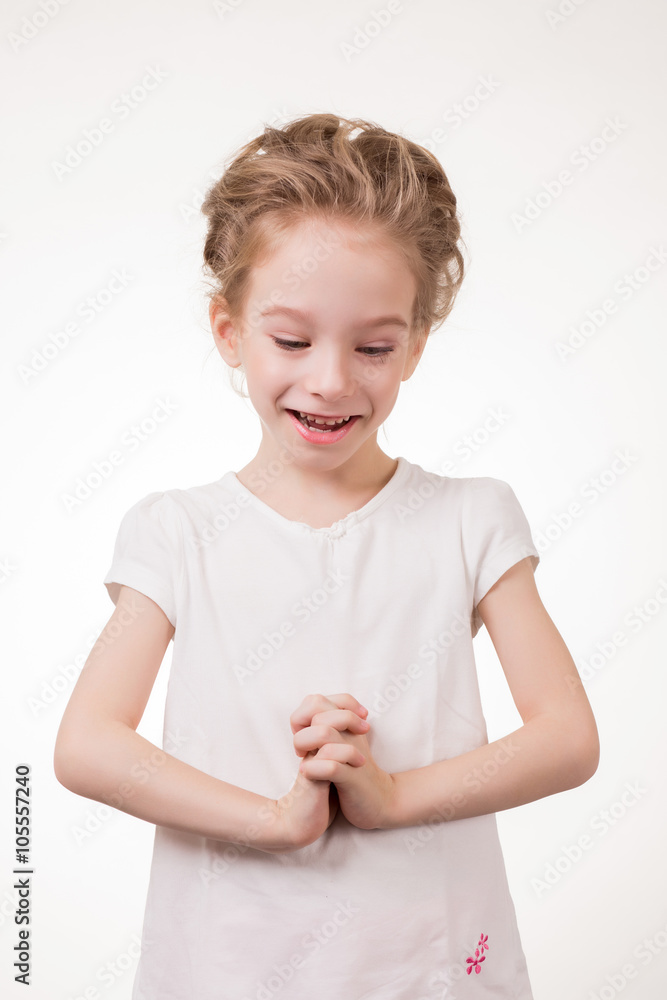 Portrait of surprised excited girl covering her mouth by the hand. Isolated on white background Portrait of surprised excited girl covering her mouth by the hand. Isolated on white background