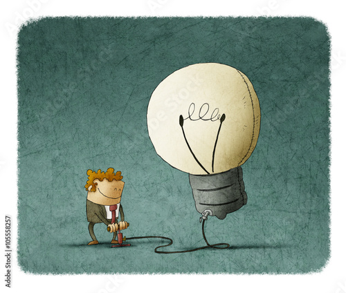 Smiling man inflating bulb