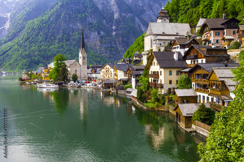 emerald lake and beautiful village Halstatt in Austrian Alps photo