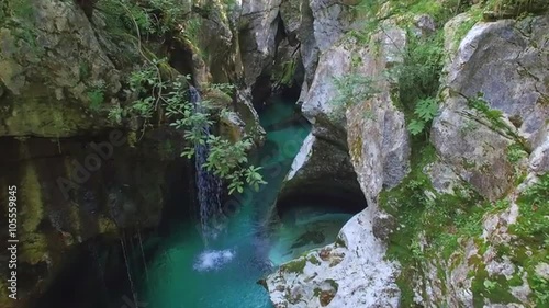 AERIAL: Blue river running through beautiful narrow rocky canyon photo